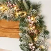 WeRChristmas Pre-Lit Extra Thick Mixed Pine Snow Flocked Garland, Pinecones & Berries, Static, 9 Ft